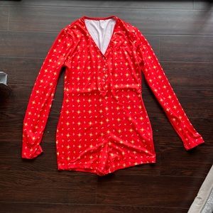 Jumper, romper, onesie, pajamas, PJ’s. Short pant, long sleeve. Star, music, red